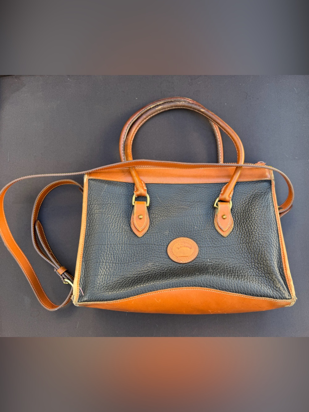 Vintage Dooney and Bourke Black and Tan Leather top handle crossbody Bag